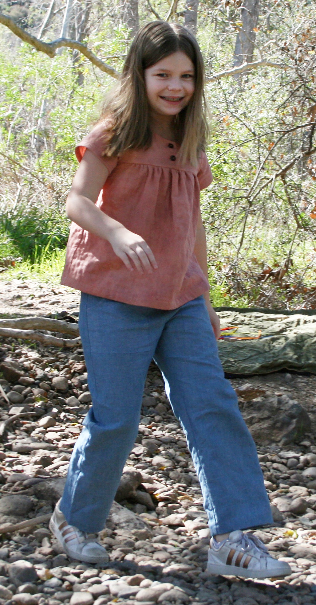 Our model is wearing size 8/9, is 8.5 years old and is 67 pounds, 52.5" tall.