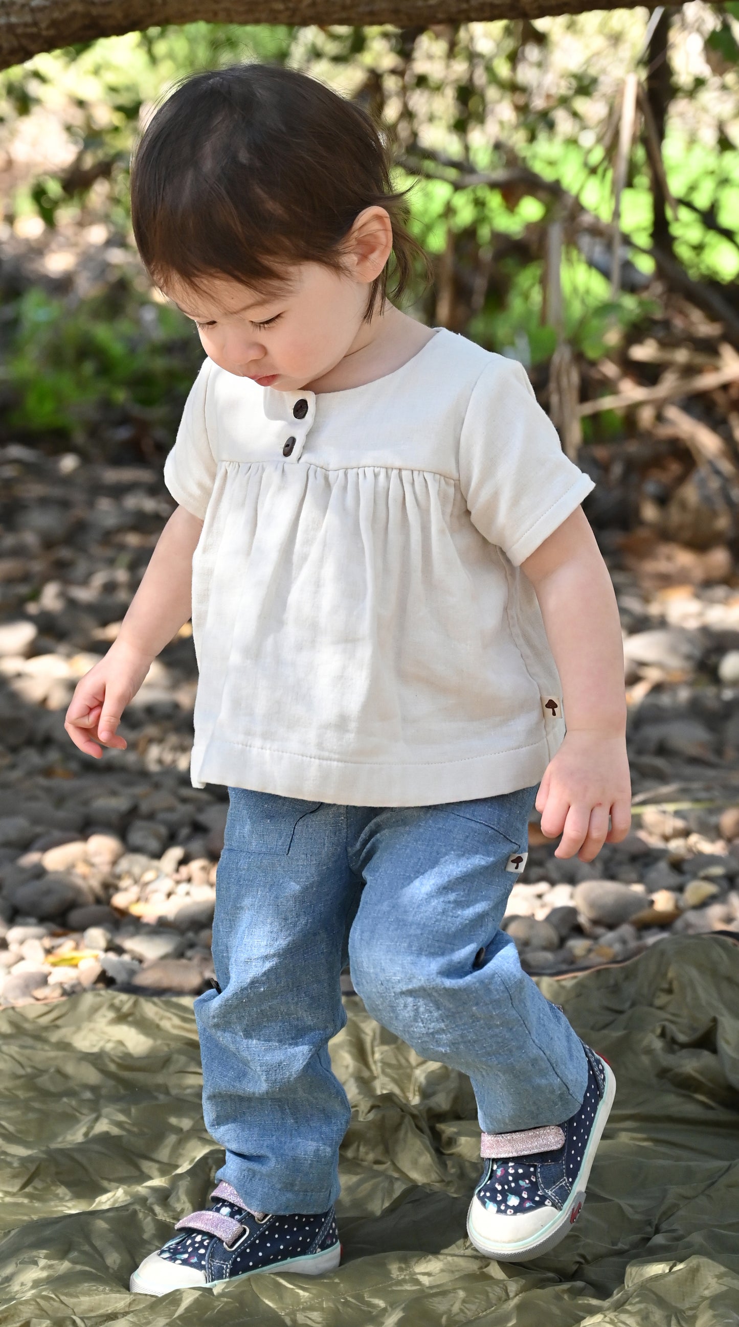 Our model is wearing size 18-24m and is 20 months, 23 lbs and 33" tall.