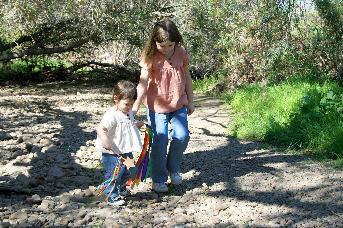 Our little model is wearing size 18-24m and is 20 months, 23 lbs and 33" tall. Our bigger model is wearing size 8/9. She is 8 1/2 years old, 67 pounds and 52.5" tall.