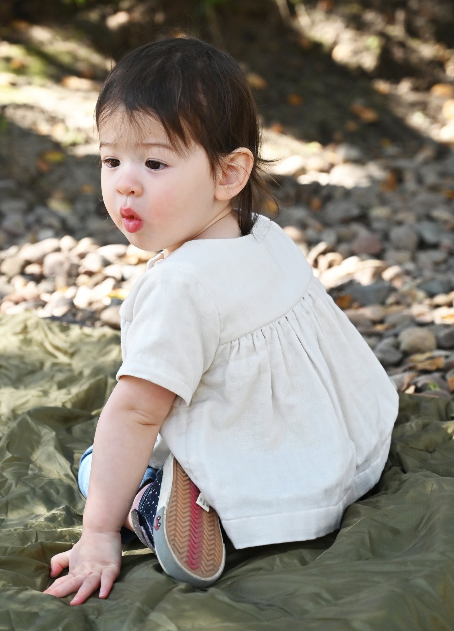 Our model is wearing size 18-24m and is 20 months, 23 lbs and 33" tall.