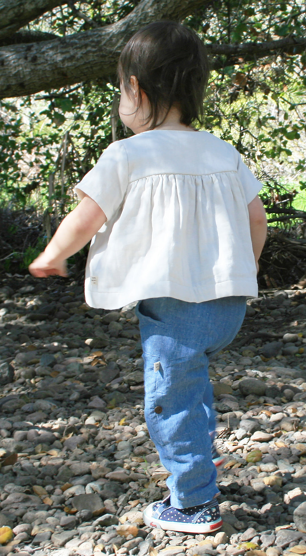 Our model is wearing size 18-24m and is 20 months, 23 lbs and 33" tall.