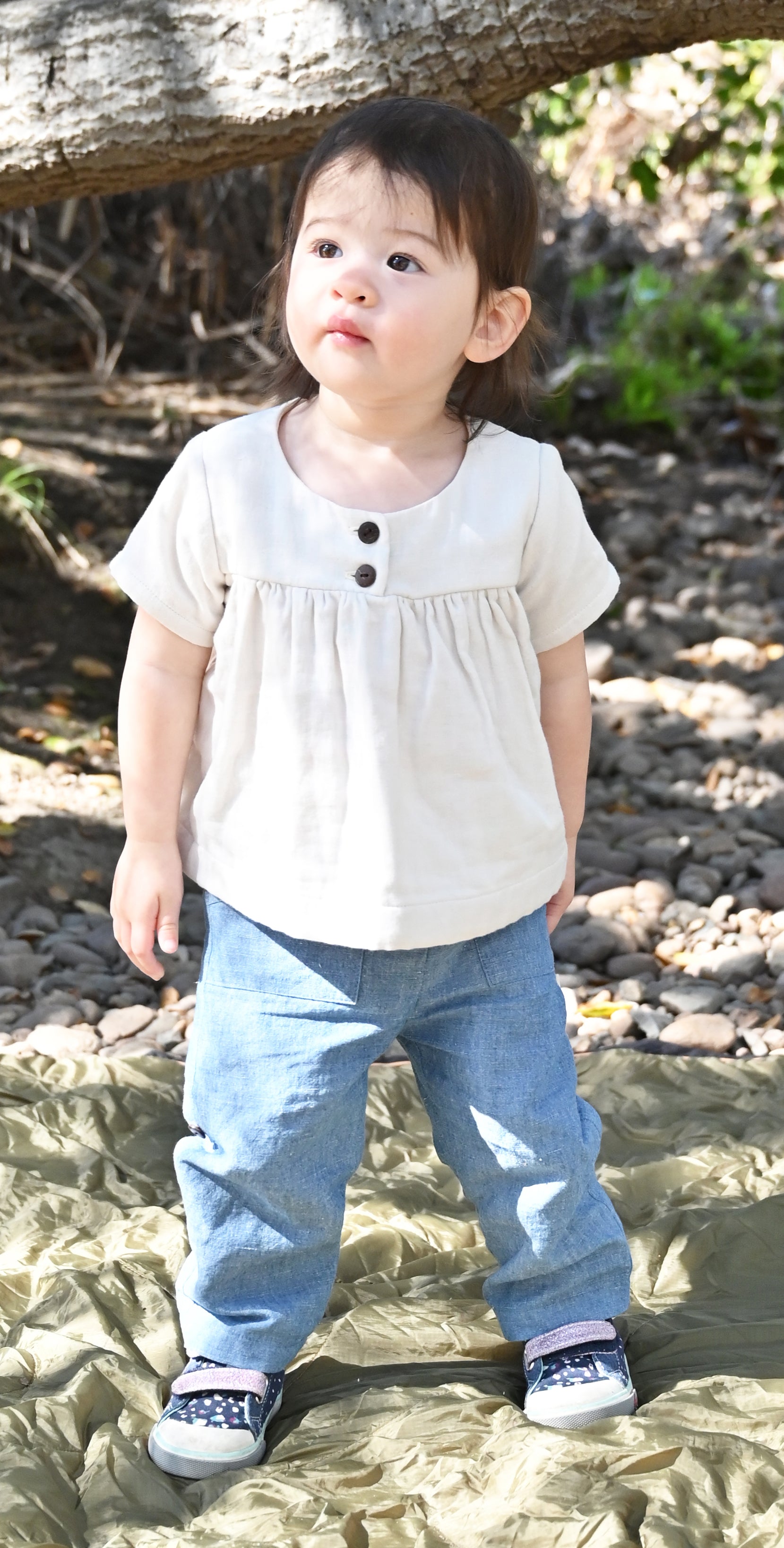 Our model is wearing size 18-24m and is 20 months, 23 lbs and 33" tall.
